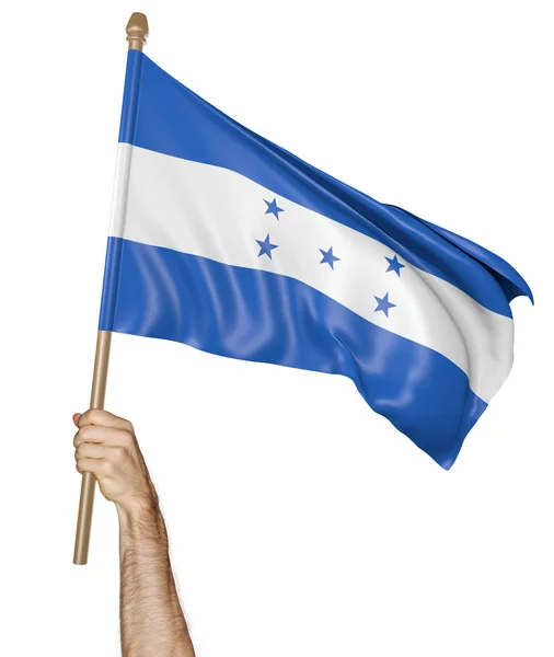 Mão orgulhosamente acenando a bandeira nacional de Honduras — Fotografia de Stock