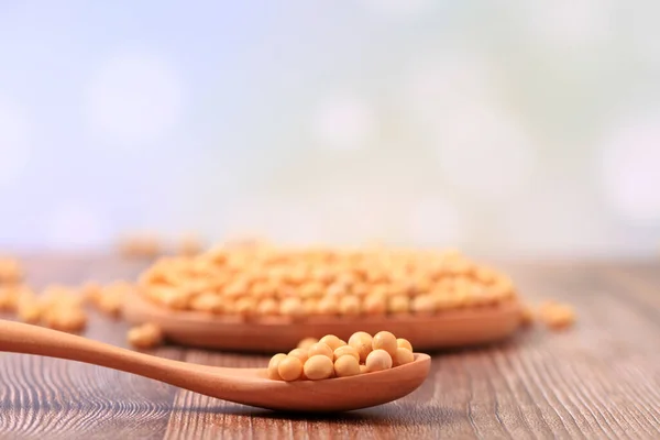 stock image The soybean are on the wooden table