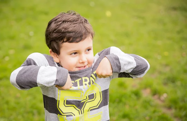 Child with muscles, powerful, funny, strong — Stock Photo, Image