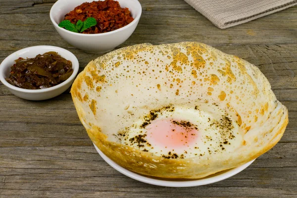 Sri Lankan style egg hopper with lunu miris and seeni sambal — Stock Photo, Image