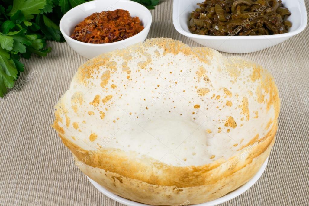 Sri Lankan style plain Hoppers in lunu miris and seeni sambal Stock