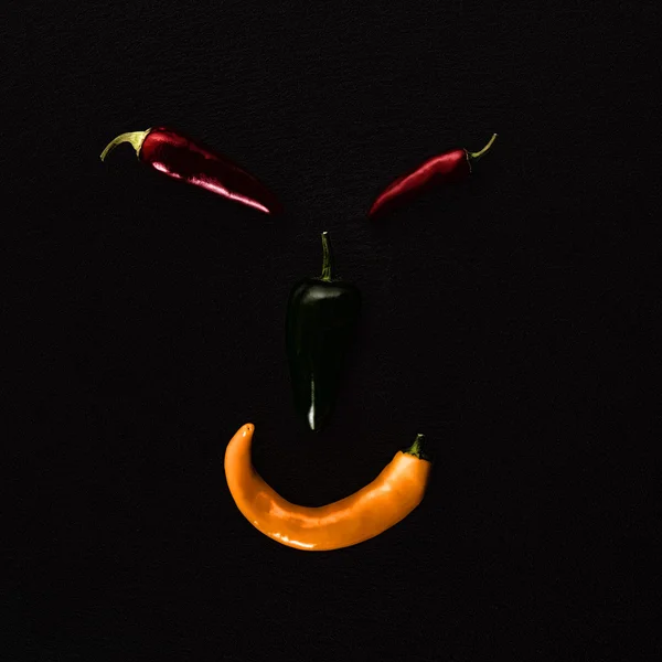 Twarz z różnych papryki chili — Zdjęcie stockowe