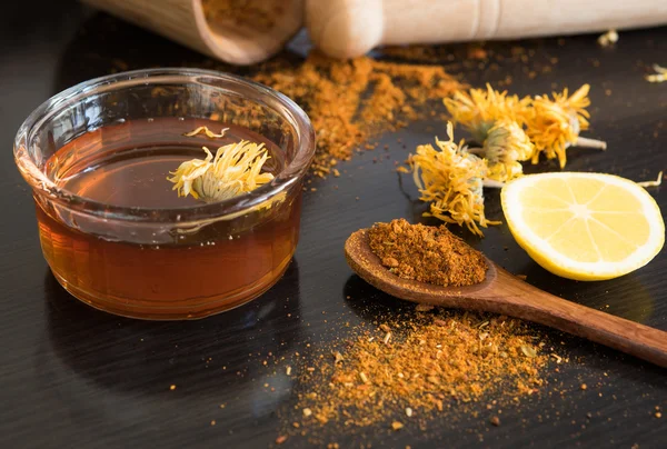 Honey and spices on dark table — Stock Photo, Image