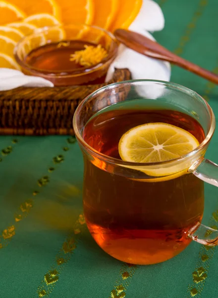 Cup of tea and citruses — Stock Photo, Image