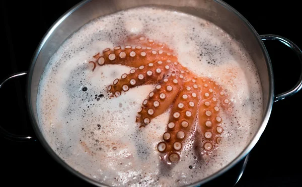 Pot with boiling octopus — Stock Photo, Image