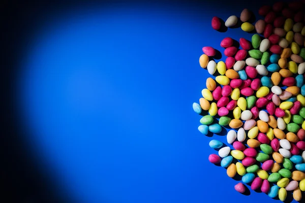 Achtergrond met bonbons en lolipops — Stockfoto