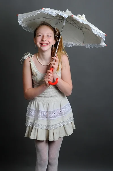 12-13 years girl under an umbrella — Stock Photo, Image