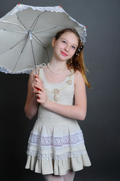 12-13 years girl under an umbrella — Stock Photo, Image