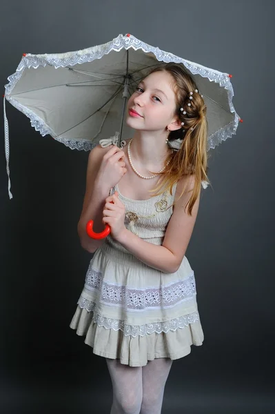 12-13 years girl under an umbrella — Stock Photo, Image