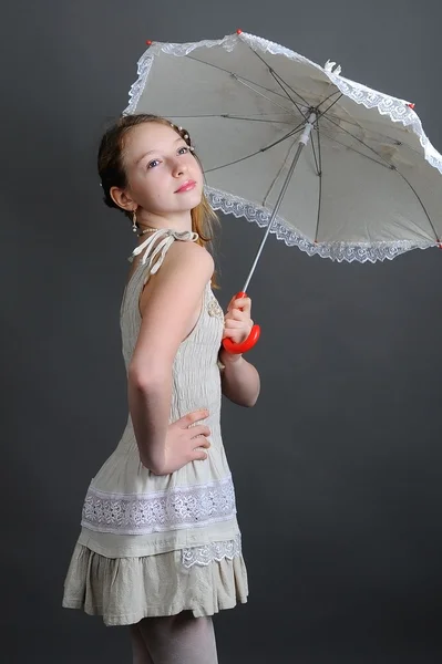 Girl in a linen sundress with sun umbrella — Stock Photo, Image