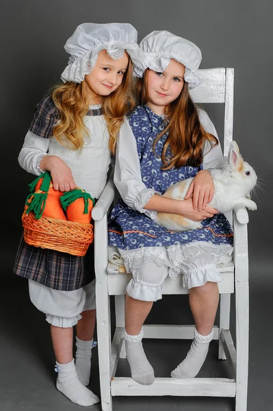 Girl in a rustic style with the Easter bunny — Stock Photo, Image