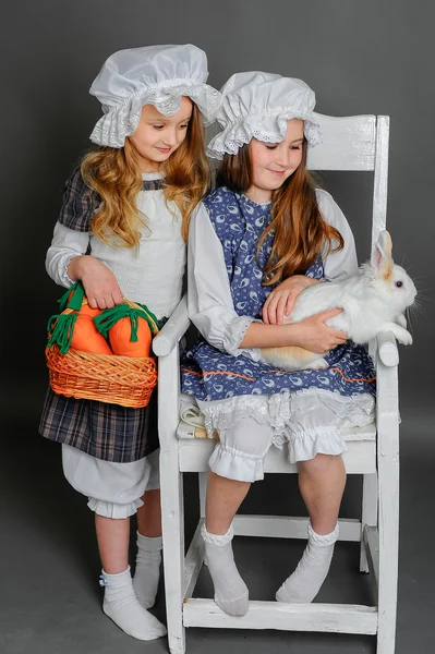 Girl in a rustic style with the Easter bunny — Stock Photo, Image