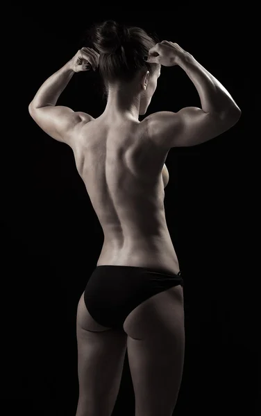 Rücken der durchtrainierten Frau zeigt Muskeln — Stockfoto