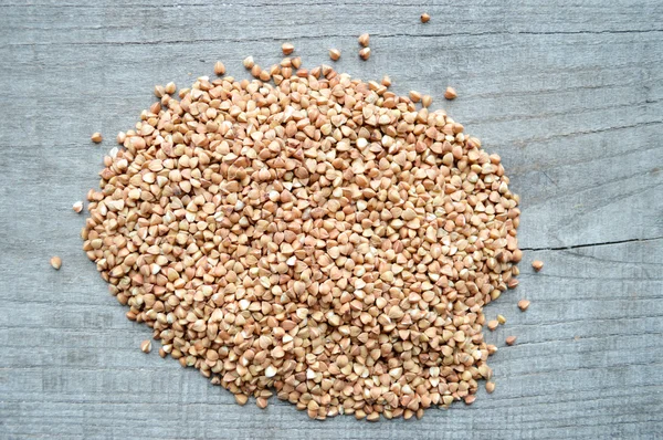 Buckwheat closeup on wooden background — Stock Photo, Image