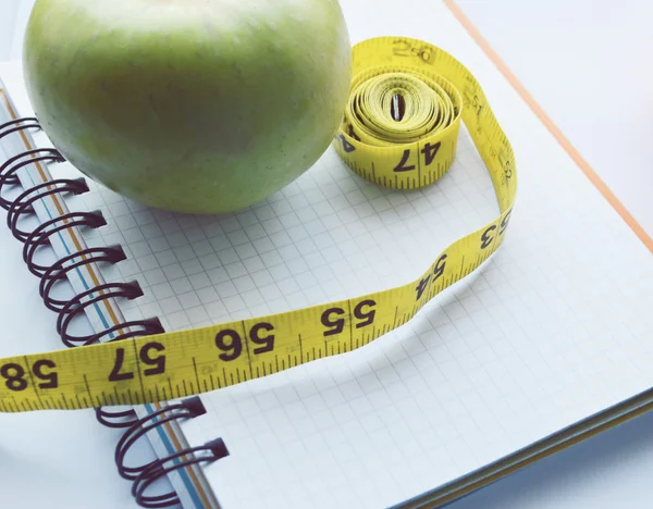 Vegetables and fruits for weight loss, a measuring tape, diet, weight loss — Stock Photo, Image