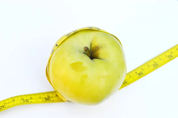 Vegetables and fruits for weight loss, a measuring tape, diet, weight loss — Stock Photo, Image