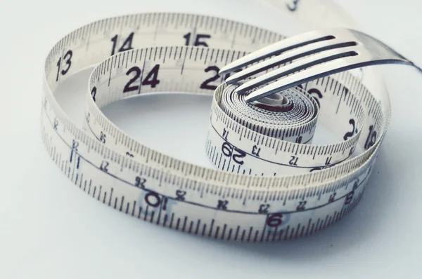 Vegetables and fruits for weight loss, a measuring tape, diet, weight loss — Stock Photo, Image