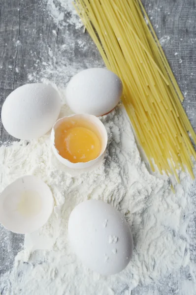 Still life with raw homemade pasta and ingredients for pasta — Stock Photo, Image