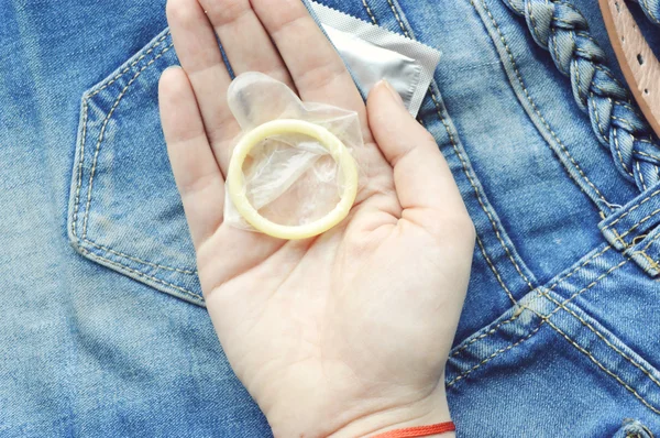 Condom in blue jeans pocket — Stock Photo, Image