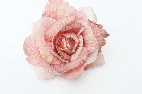白い背景に分離されたバラの形にピンクの髪留め — ストック写真