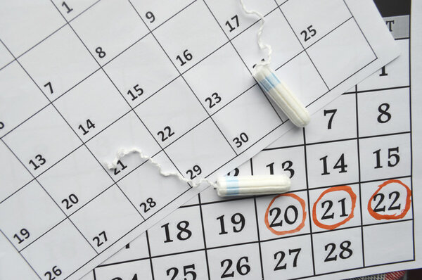 Menstruation calendar with sanitary tampons