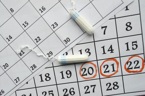 Menstruation calendar with sanitary tampons
