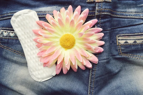 Woman sanitary pad and orange Gerber — Stock Photo, Image