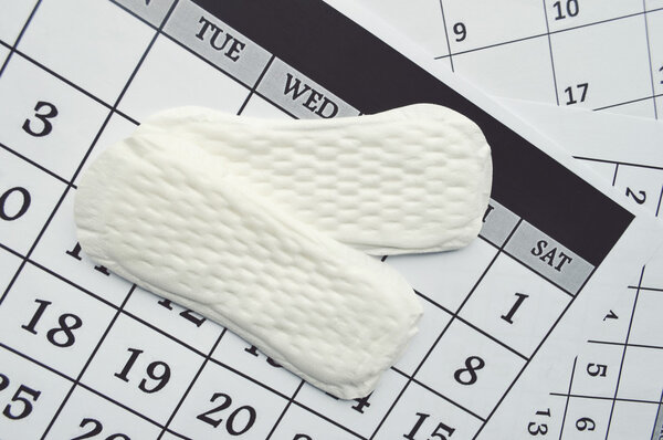 Menstruation calendar with sanitary pads