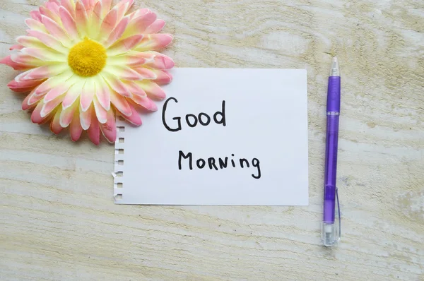 Hoja de papel con signo de buenos días y pluma — Foto de Stock