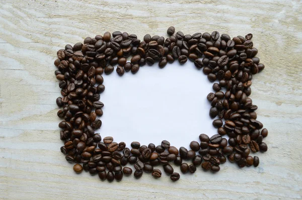 White sheet of paper with coffee beans frame — Stock Photo, Image