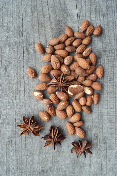 Nuts on rustic old wooden table — Stock Photo, Image