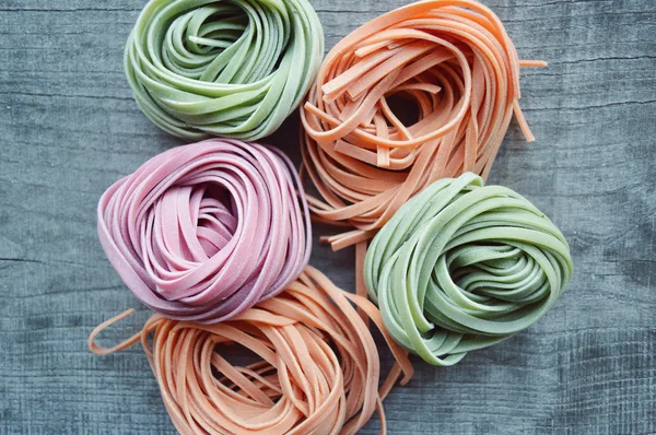 Colorful raw italian pasta — Stock Photo, Image