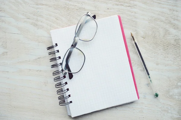 Notebooks with pen and glasses — Stock Photo, Image