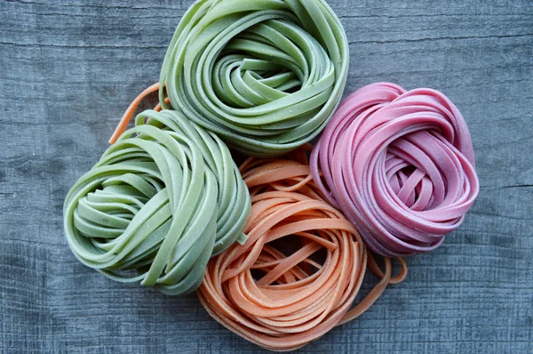 Colorful raw italian pasta — Stock Photo, Image