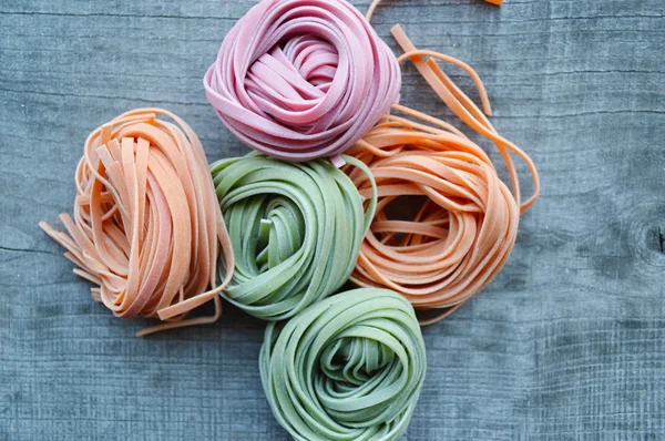 Colorful raw italian pasta — Stock Photo, Image