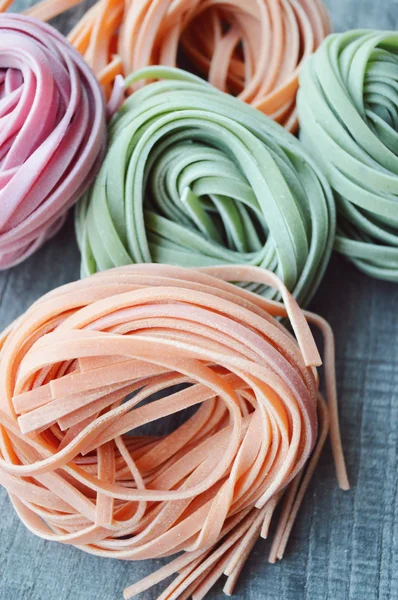 Colorful raw italian pasta — Stock Photo, Image