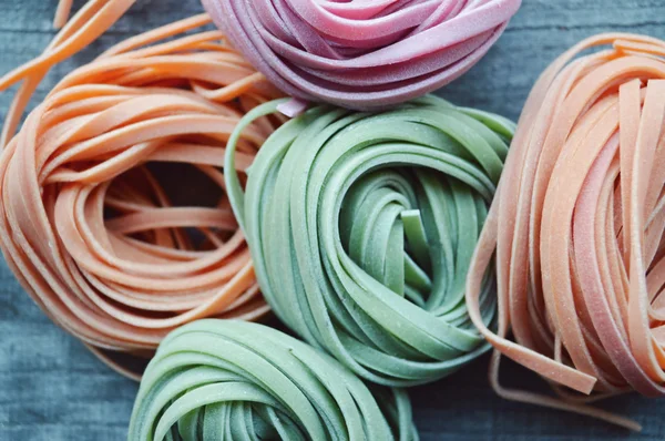 Colorful raw italian pasta — Stock Photo, Image