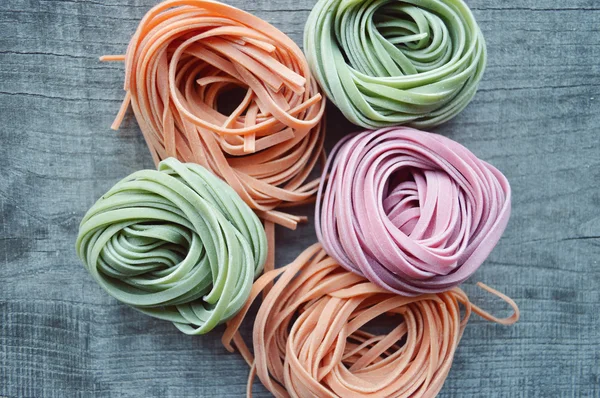 Colorful raw italian pasta — Stock Photo, Image