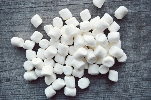 Marshmallows on wooden table — Stock Photo, Image
