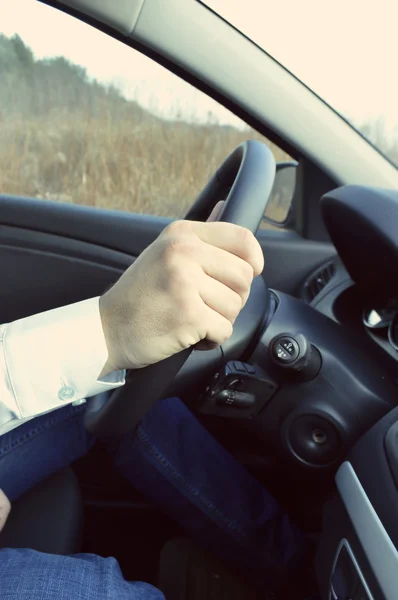 The driver behind the wheel of a car Royalty Free Stock Photos