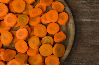 plate with cut carrots seen from above. salad ingredient or healthy meals