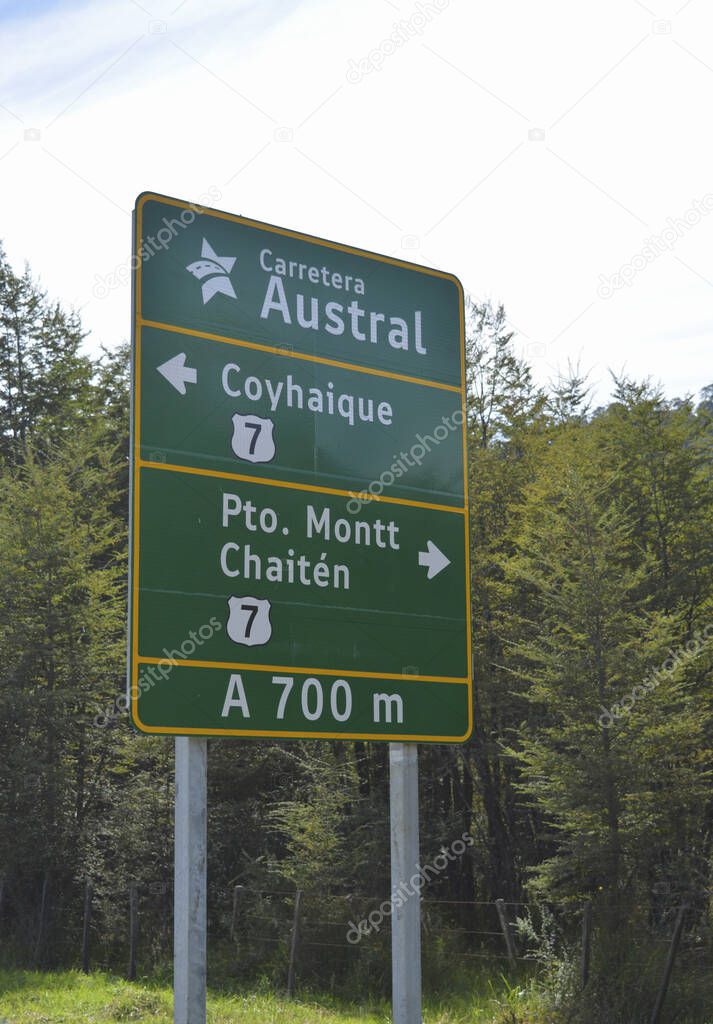 poster of the austral highway, direction to puerto mont and chaiten in chile, mountain road of the cordillera