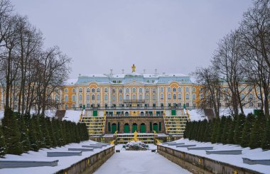 The Peterhof Palace(Petrodvorets) with snow, tree and alley. State Museum. Palace and park referred to Russian Versailles, St. Petersburg, Russia. Feb. 2017.