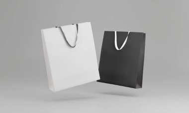 Siyah ve beyaz alışveriş çantası gri arka planda izole edilmiş. 3d oluşturma