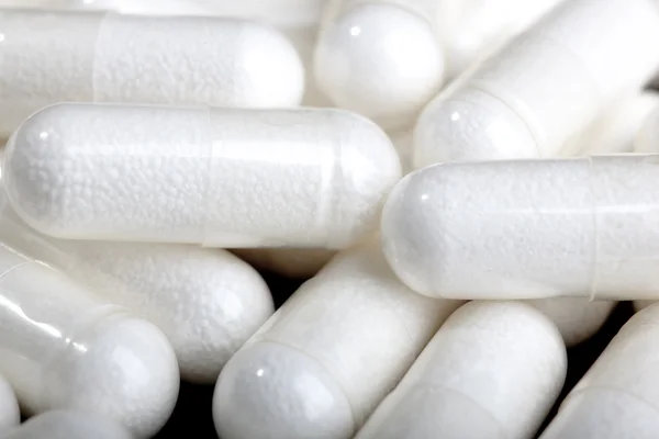 Píldoras blancas grupo cápsula —  Fotos de Stock