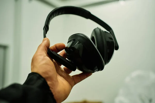 headphones for protection against noise impacts in black and on white background