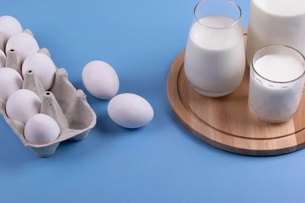 white eggs and milk as calcium concept. minimalism style.