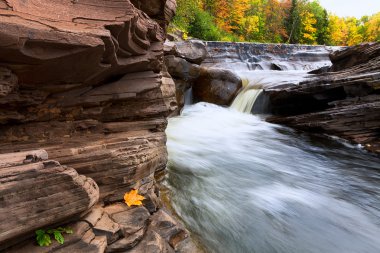 Michigan's Upper Peninsula Bonanza Falls in Autumn clipart