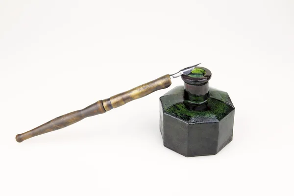 Vintage ink pen and old glass inkwell isolated — Stock Photo, Image