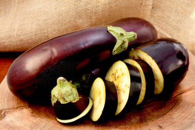 fresh eggplant on the wooden table